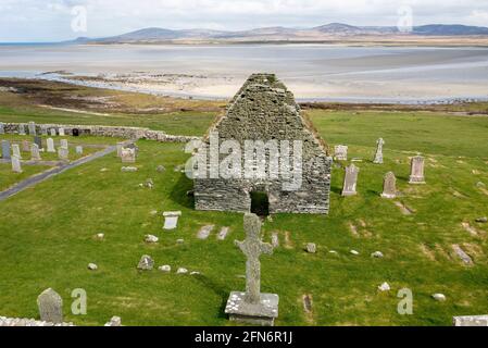 Aerial view Kilnave Chapel and Cross situated on the west bank of Loch Gruinart, Isle of Islay, Inner Hebrides, Scotland. Stock Photo