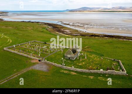 Aerial view Kilnave Chapel and Cross situated on the west bank of Loch Gruinart, Isle of Islay, Inner Hebrides, Scotland. Stock Photo