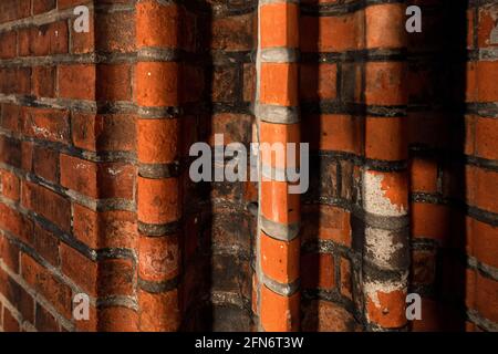 Rounded old brickwork in the wall, close-up Stock Photo