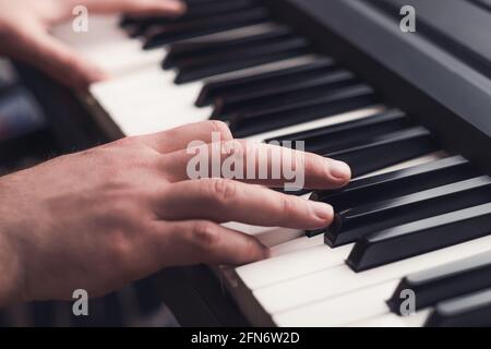 Man playing piano close up Stock Photo