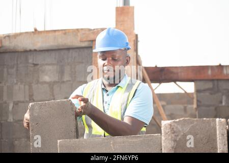 a building contractor laying bricks Stock Photo