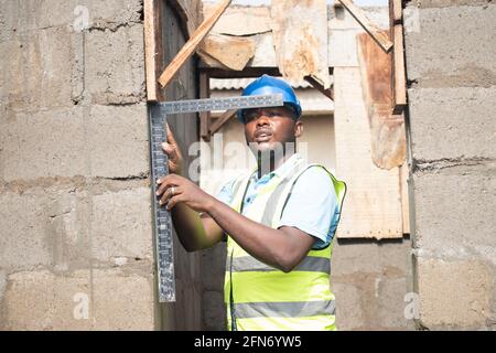 a building contractor using a square Stock Photo