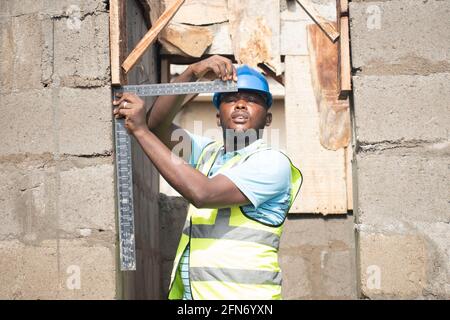 a building contractor using a square Stock Photo