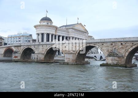 Stone Bridge, behind the Archeology Museum at Skopje in Macedonia. Stone Bridge is considered a symbol of Skopje. Stock Photo