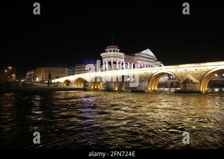 Stone Bridge, behind the Archeology Museum at night in Skopje, Macedonia. Stone Bridge is considered a symbol of Skopje. Stock Photo