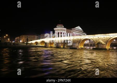 Stone Bridge, behind the Archeology Museum at night in Skopje, Macedonia. Stone Bridge is considered a symbol of Skopje. Stock Photo