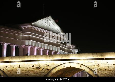 Stone Bridge, behind the Archeology Museum at night in Skopje, Macedonia. Stone Bridge is considered a symbol of Skopje. Stock Photo