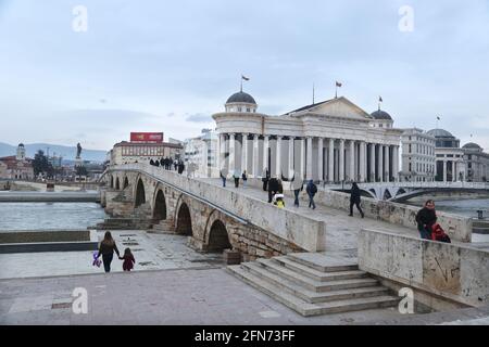 SKOPJE, MACEDONIA - DECEMBER 25: Stone Bridge and behind the Archeology Museum in Skopje on December 25, 2016 in Macedonia. Stone bridge is considered a symbol of Skopje. Stock Photo