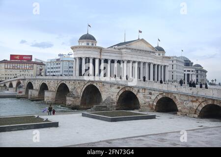 SKOPJE, MACEDONIA - DECEMBER 25: Stone Bridge and behind the Archeology Museum in Skopje on December 25, 2016 in Macedonia. Stone bridge is considered a symbol of Skopje. Stock Photo