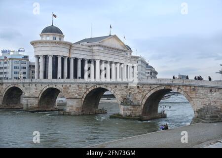 SKOPJE, MACEDONIA - DECEMBER 25: Stone Bridge and behind the Archeology Museum in Skopje on December 25, 2016 in Macedonia. Stone bridge is considered a symbol of Skopje. Stock Photo