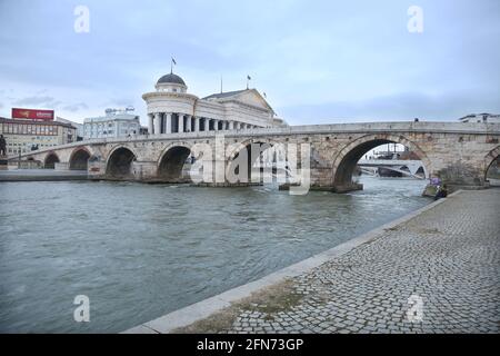 SKOPJE, MACEDONIA - DECEMBER 25: Stone Bridge and behind the Archeology Museum in Skopje on December 25, 2016 in Macedonia. Stone bridge is considered a symbol of Skopje. Stock Photo