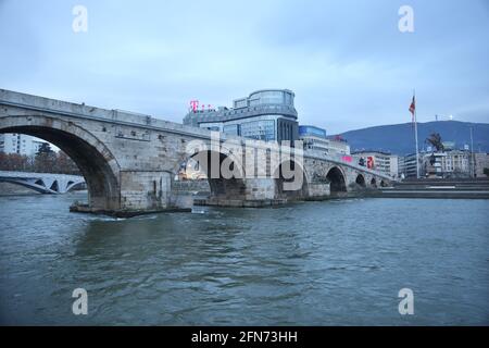 SKOPJE, MACEDONIA - DECEMBER 25: Stone Bridge at cloudy day in Skopje on December 25, 2016 in Macedonia. Stone bridge is considered a symbol of Skopje. Stock Photo