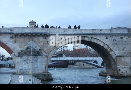 SKOPJE, MACEDONIA - DECEMBER 25: Stone Bridge at cloudy day in Skopje on December 25, 2016 in Macedonia. Stone bridge is considered a symbol of Skopje. Stock Photo