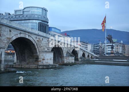 SKOPJE, MACEDONIA - DECEMBER 25: Stone Bridge at cloudy day in Skopje on December 25, 2016 in Macedonia. Stone bridge is considered a symbol of Skopje. Stock Photo