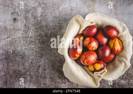 Top down flat lay view on easter eggs painted and decorated on marble background with copy space Stock Photo
