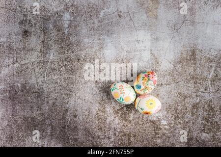 Top down flat lay view on easter eggs painted and decorated on marble background with copy space Stock Photo