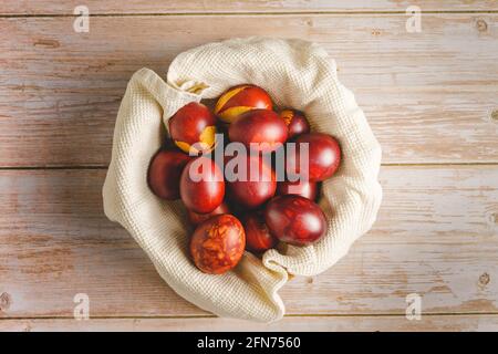 Top down flat lay view on easter eggs painted on wooden background with copy space Stock Photo