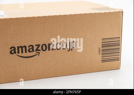 Fuji City, Shizuoka-Ken, Japan - April 29, 2021: Cardboard box for delivery of goods from Amazon Japan. Isolated on white background. Stock Photo