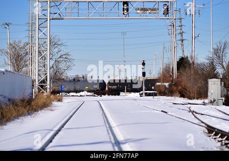 Franklin Park, Illinois, USA. A Canadian Pacific Railway freight train after leaving the railway's Bensenville Yard passing through a diamond crossing. Stock Photo