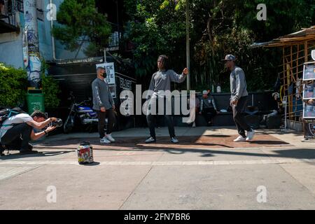 Medellin, Antioquia, Colombia - December 23 2020: Young Men Break Dance in Black and Grey Outfits in the Comuna 13 Stock Photo