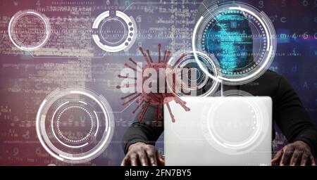 Composition of covid 19 virus cell and binary coding data processing over hacker using laptop. global virus pandemic and cyber attack concept digitall Stock Photo