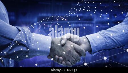 Network of connections over mid section of two businessmen shaking hands against data processing Stock Photo