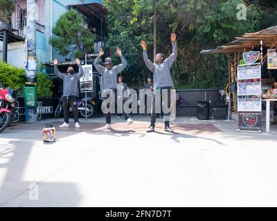 Medellin, Antioquia, Colombia - December 23 2020: Young Men Break Dance in Black and Grey Outfits in the Comuna 13 Stock Photo