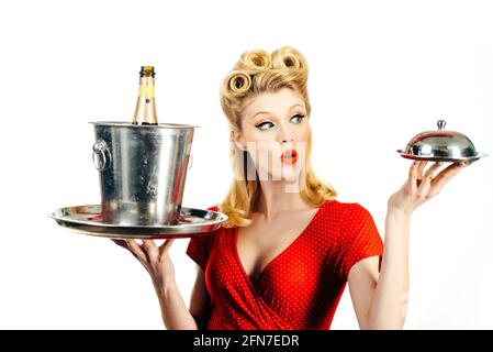 Restaurant waiter. Pinup girl with service tray. Serving presentation concept. Stock Photo