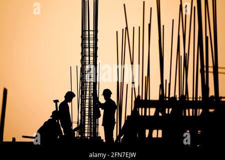 construction worker silhouette on the work place Stock Photo