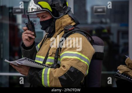 Moscow, Russia. 14th May, 2021. A fire brigade during a demonstration exercise to extinguish a fire in Moscow, Russia Stock Photo