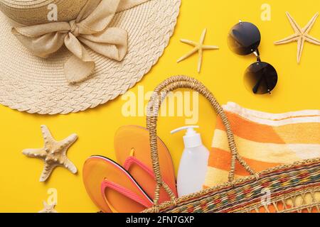 Flat composition with beach holiday accessories on colored background with top view, summer background. Stock Photo
