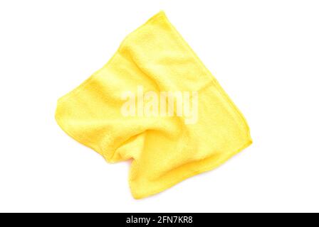 Yellow kitchen rug isolated on white. Crumpled used microfiber cloth clean, top view. Stock Photo
