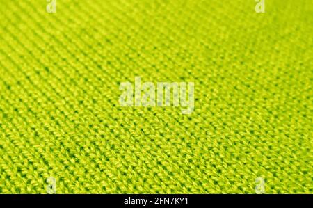 Closeup of Lime Green Alpaca Knitted Wool Fabric Texture in Diagonal Patterns for Background or Banner Stock Photo