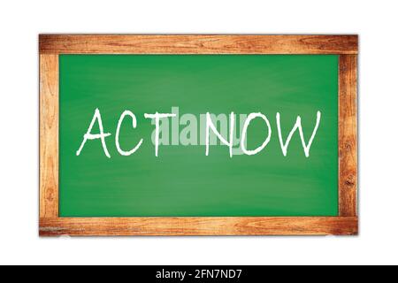 ACT  NOW text written on green wooden frame school blackboard. Stock Photo