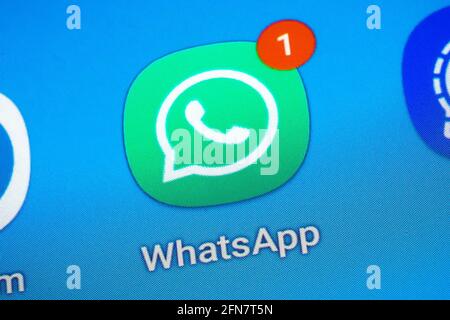 Logo of the social media messenger app WhatsApp on the screen of a smartphone Stock Photo