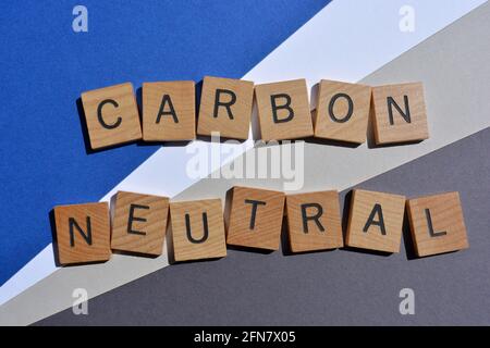 Carbon Neutral, words in wooden alphabet letters isolated on background Stock Photo