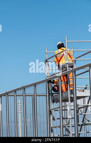 Workers working on scaffolding Stock Photo