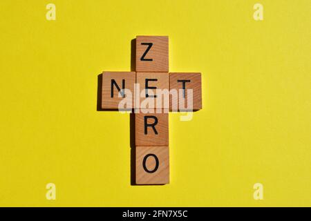 Net Zero, word in crossword form isolated on yellow background Stock Photo