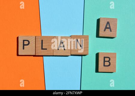 Plan A, or B, words in wooden alphabet letters isolated on colourful background