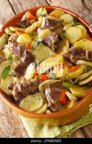 Baeckeoffe is a casserole dish a mix of sliced potatoes, sliced onions, cubed mutton, beef, and pork which have been marinated in Alsatian white wine Stock Photo