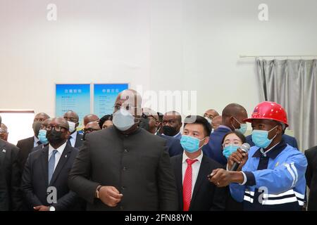 Kinshasa. 15th May, 2021. President of the Democratic Republic of the Congo (DRC) Felix Tshisekedi (C) visits the Sino Congolaise des Mines, a joint venture between the DRC state mining company Gecamines and a group of Chinese companies, in Kolwezi of the southeastern province of Lualaba, DRC, on May 13, 2021. Felix Tshisekedi said on Thursday that he attaches great importance to DRC-China relations and intends to deepen mining and infrastructure cooperation with Chinese companies. Credit: Xinhua/Alamy Live News Stock Photo