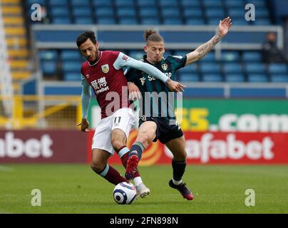Burnley, UK. 15th May, 2021. Dwight McNeil of Burnley tackles by Kalvin Phillips of Leeds United during the Premier League match at Turf Moor, Burnley. Picture credit should read: Darren Staples/Sportimage Credit: Sportimage/Alamy Live News Stock Photo