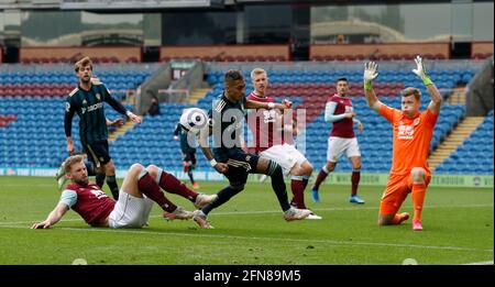 Burnley, UK. 15th May, 2021. Charlie Taylor of Burnley tackles Raphinha of Leeds United as he bares down on the goal during the Premier League match at Turf Moor, Burnley. Picture credit should read: Darren Staples/Sportimage Credit: Sportimage/Alamy Live News Stock Photo