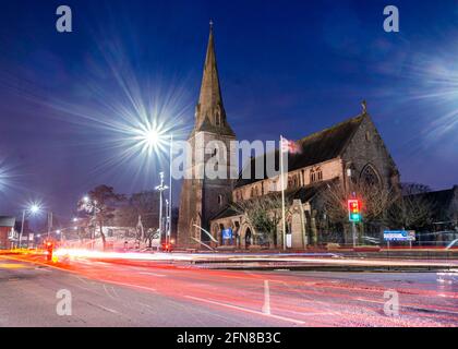 Wigan, UK, Feb 13 2021: A long exposure photograph documenting St Peter's Church, Hindley, during rush hour Stock Photo