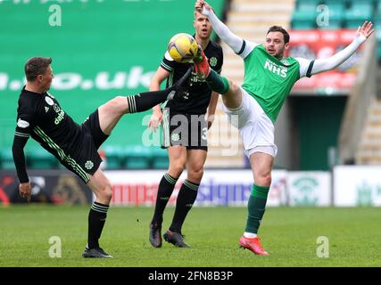 Celtic's Callum McGregor (left) and Hibernian's Drey Wright battle for the ball during the Scottish Premiership match at Easter Road, Edinburgh. Picture date: Saturday May 15, 2021. Stock Photo