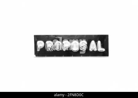 Embossed letter with word proposal in black banner on white paper background Stock Photo