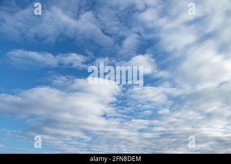 Spindrift clouds. Blue sky with white clouds. Stock Photo