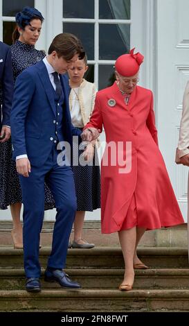 Prince Christian helps 'grand-mother' Queen Margrethe Crownprince Family in back during Prince Christian’s confirmation at Fredensborg Palace Church in Denmark on May 15, 2021. Photo by Stefan Lindblom/Stella Pictures/ABACAPRESS.COM Stock Photo