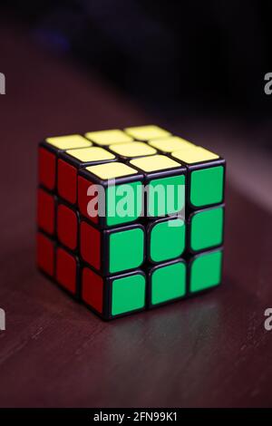 colorful rubik's cube on the table. Stock Photo