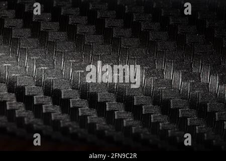 Black patterned textured background for design purpose. Ultra Glossy Carbon Fiber Vinyl Car Wrap Stock Photo